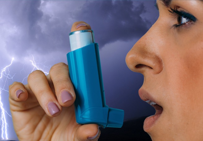 A woman using asthma medication to prevent thunderstorm asthma in Melbourne